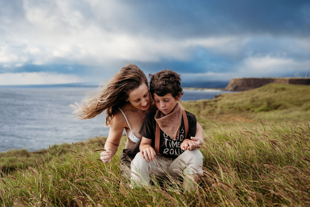 Photo of a mom and her son sitting in the grass by South Shore Photographer and Boston Area Photographer Caryn Scanlan