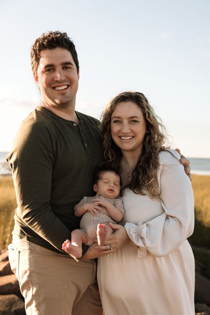 Brewster MA Newborn Beach Session | Brianna, Tyler & Baby Graham 3 Brewster MA Newborn Beach Session photo of a family with their baby by Caryn Scanlan