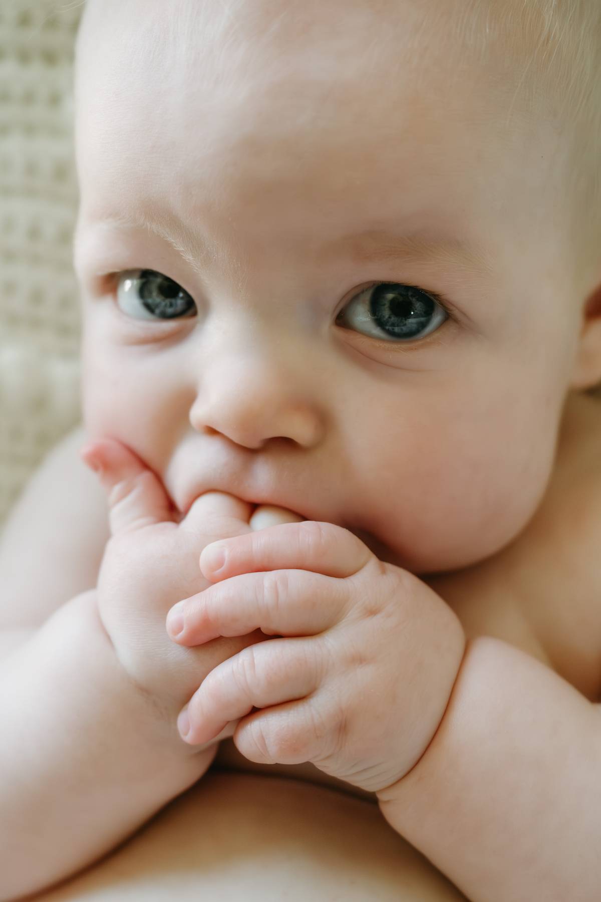 6 month old baby session on the South Shore MA sucking his fingers