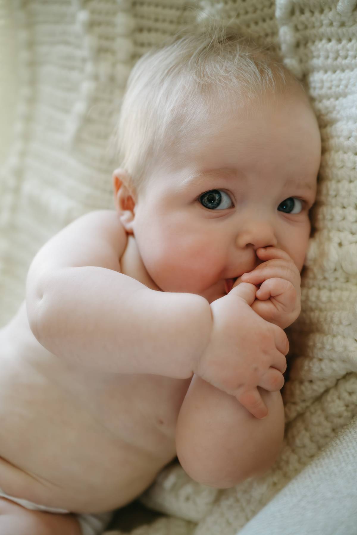 6 month old baby session on the South Shore MA sucking his thumb