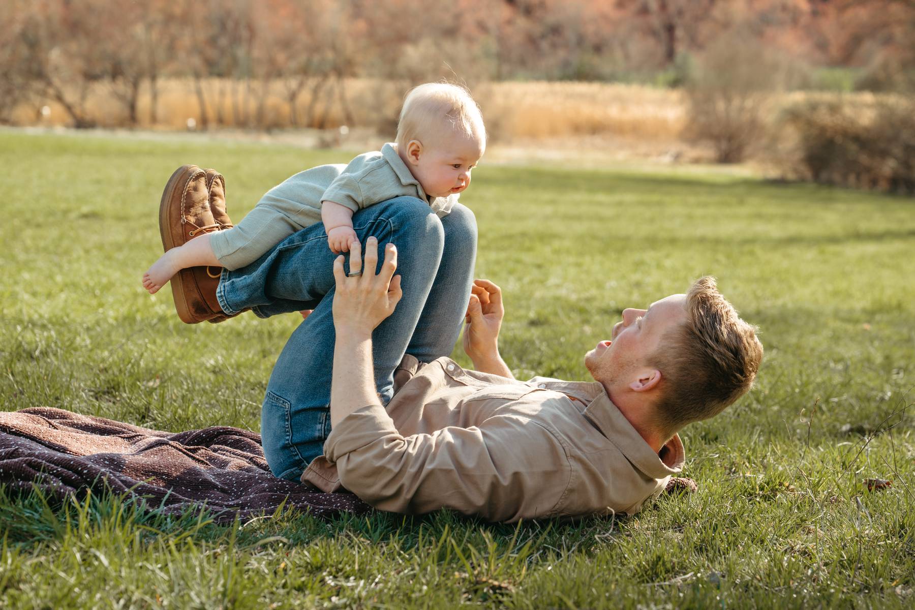 6 month old baby session on the South Shore MA playing with his dad