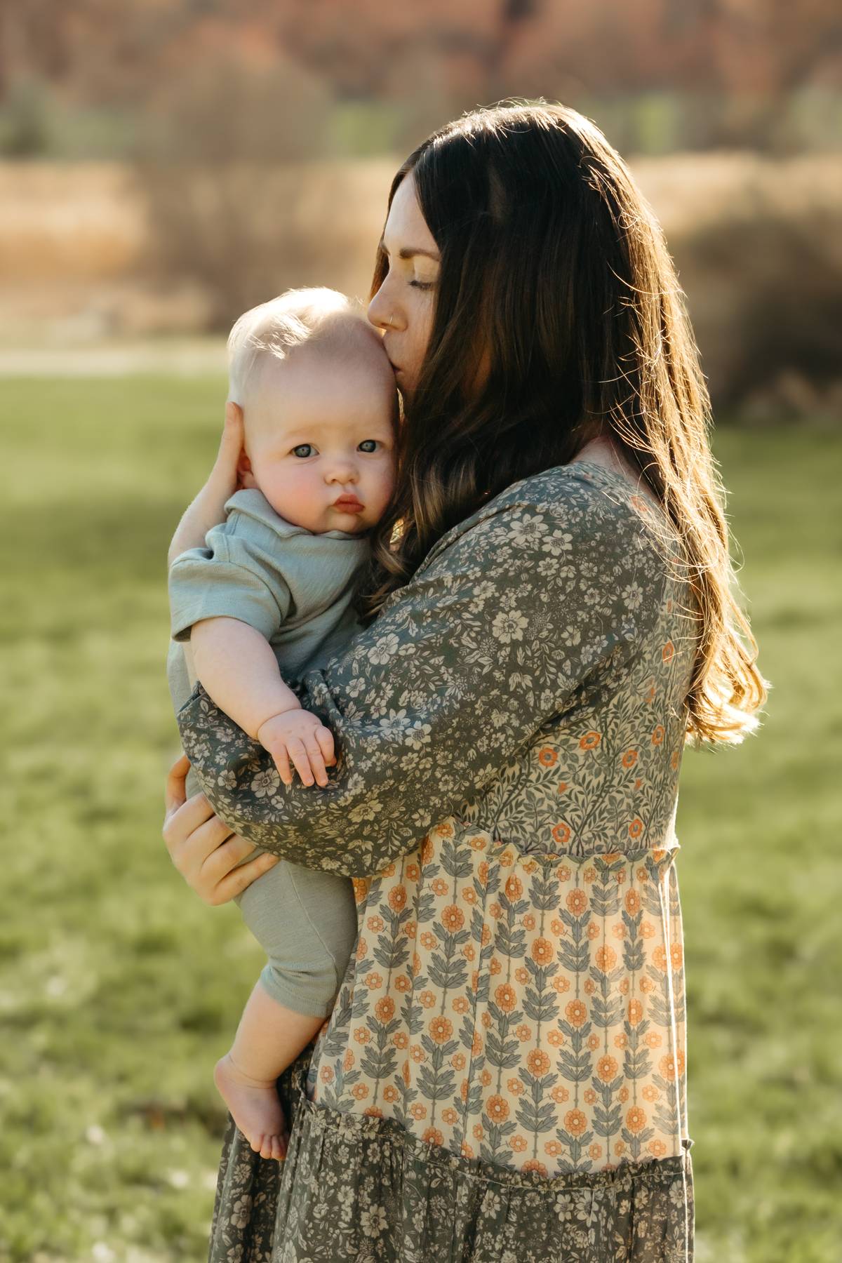 6 month old baby session on the South Shore MA cuddling with his mom