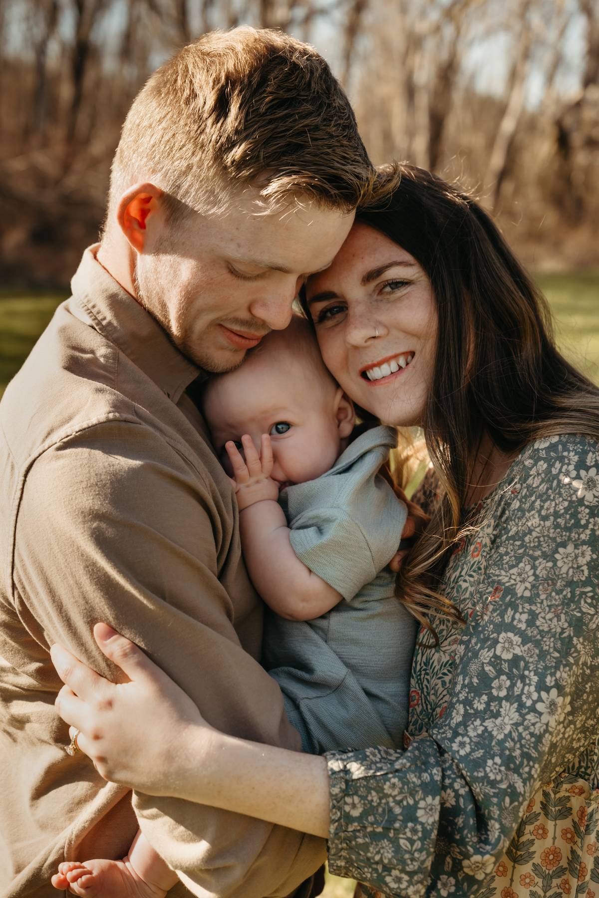 6 month old baby session on the South Shore MA cuddling with his parents