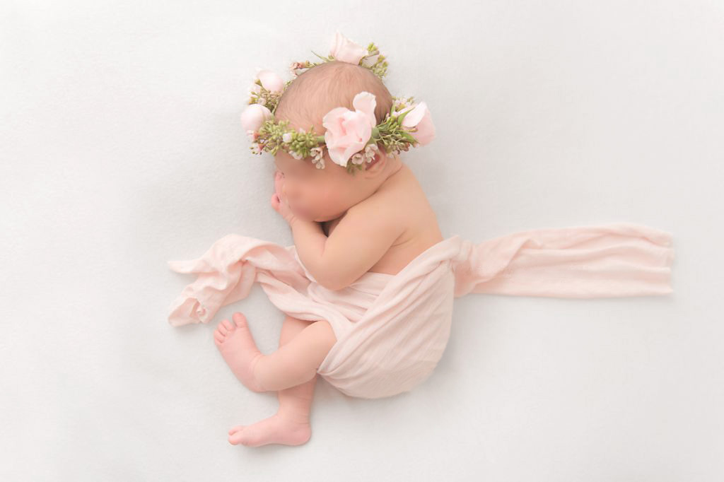 Cape Cod Newborn Photographer photo of a newborn with a flower crown